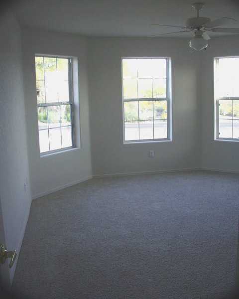 Guest bedroom / will set this up with a bookcase/tv stand, hide-a-bed, & chair & make it a reading room/guest bedroom / bay windows let in lots of light