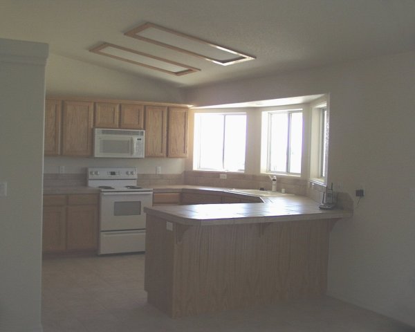 Kitchen with bay windows / small view of lake from here