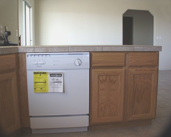 Kitchen - dishwasher / Oak cabinets / Dining room