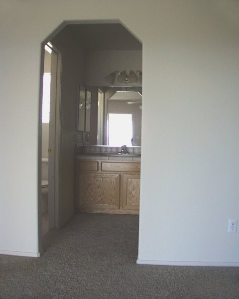Master bathroom / cabinet wraps around & has 2nd sink, mirror, & lights behind the wall on the right side 
